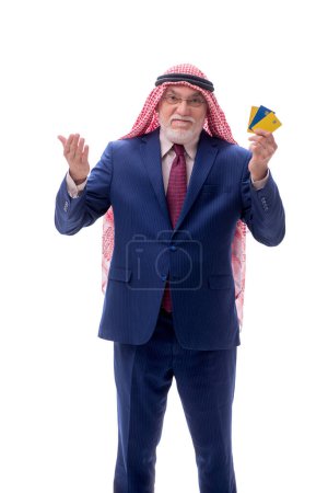 Photo for Aged arab businessman holding credit cards isolated on white - Royalty Free Image