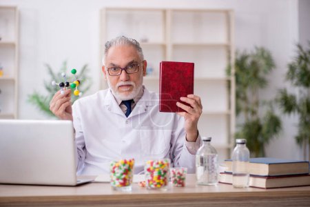 Photo for Old doctor holding molecular model - Royalty Free Image