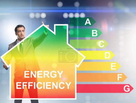Téléchargez les photos : Le concept d'homme d'affaires en efficacité énergétique - en image libre de droit
