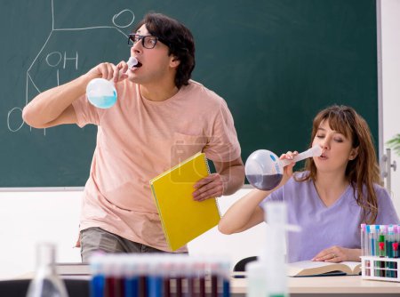 Photo for The two chemists students in classroom - Royalty Free Image