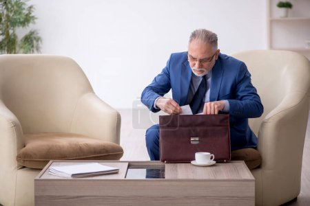Photo for Old male boss waiting for business meeting - Royalty Free Image
