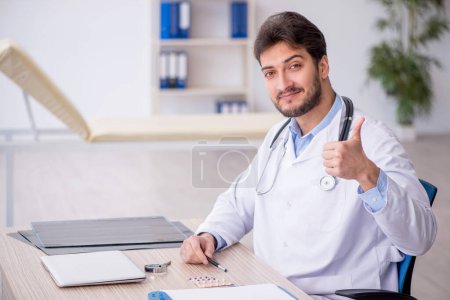Photo for Young doctor working at the hospital - Royalty Free Image