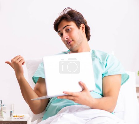 Photo for The young handsome man staying in hospital - Royalty Free Image