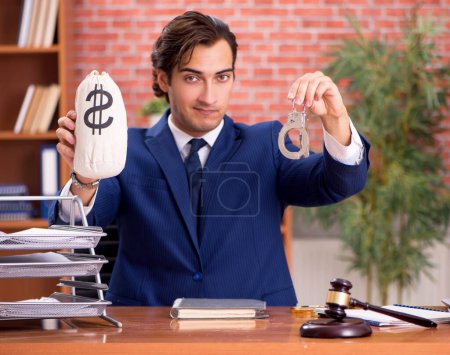 Photo for The young handsome lawyer working in his office - Royalty Free Image