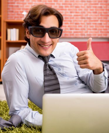 Photo for The young employee with virtual glasses during break in the office - Royalty Free Image