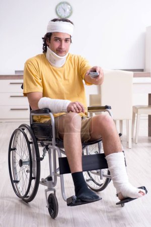 Photo for The young man after accident recovering at home - Royalty Free Image