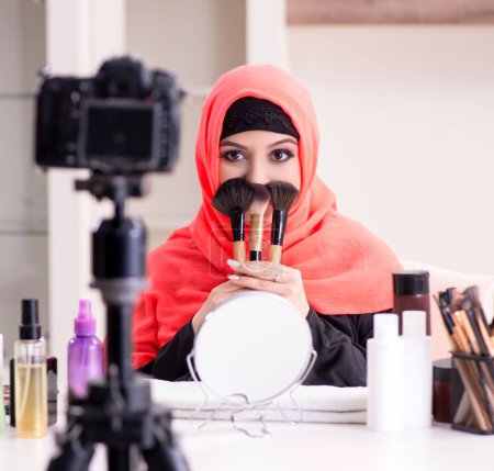 Photo for The beauty blogger in hijab recording video for her blog - Royalty Free Image