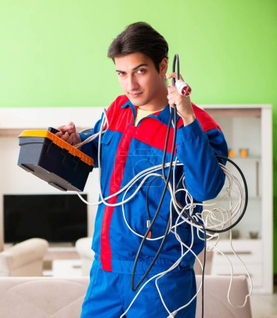 Photo for The electrician contractor with tangled cables - Royalty Free Image