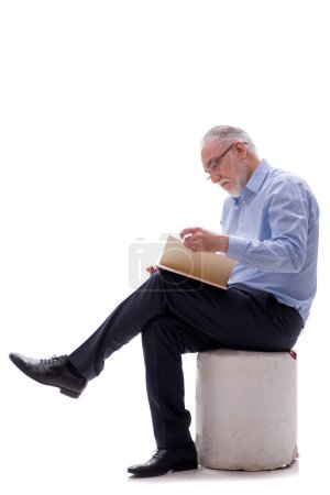 Photo for Old male boss reading book isolated on white - Royalty Free Image