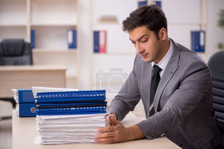 Photo for Young businessman employee working at workplace - Royalty Free Image
