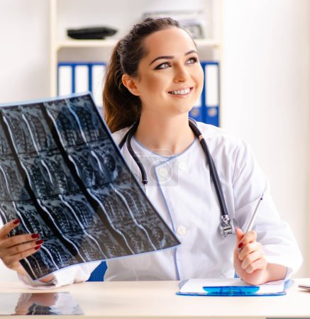 Photo for The young female doctor radiologist sitting at the clinic - Royalty Free Image