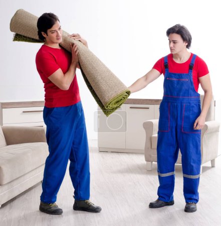 Photo for The two young contractor employees moving personal belongings - Royalty Free Image