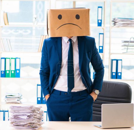 Photo for The unhappy man with box instead of his head - Royalty Free Image