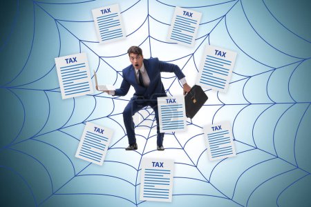 Photo for Businessman caught in web of taxes - Royalty Free Image