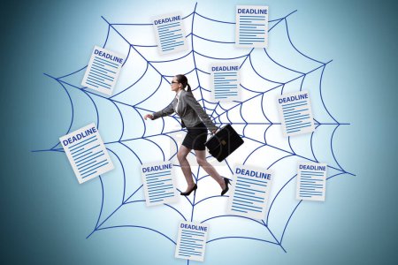 Photo for Businesswoman caught in web of deadlines - Royalty Free Image