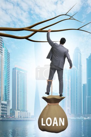 Photo for Businessman hanging on the tree branch - Royalty Free Image
