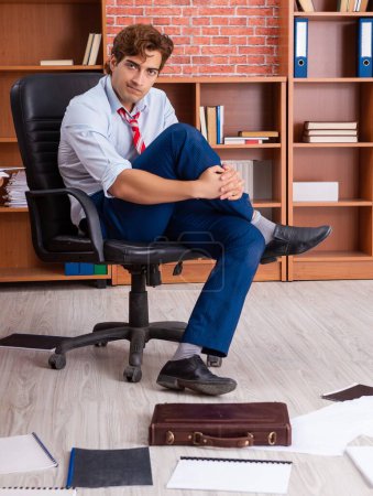 Photo for The unhappy businessman sitting in the office - Royalty Free Image