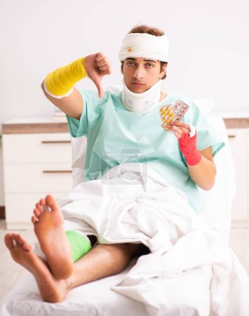 Photo for The young injured man staying in the hospital - Royalty Free Image