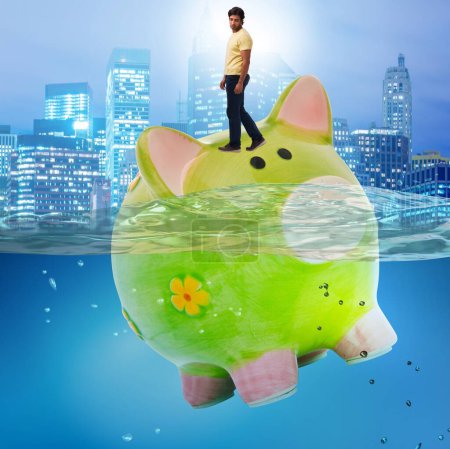 Photo for The student debt concept with piggybank and student - Royalty Free Image