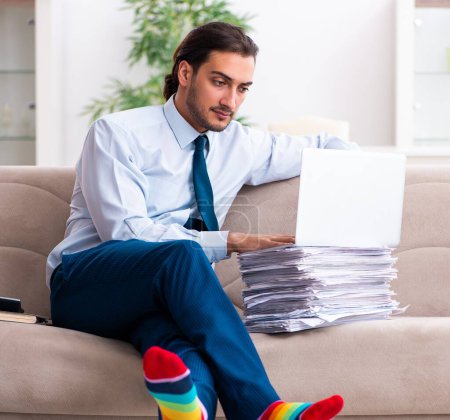 Photo for The young male businessman working at home - Royalty Free Image