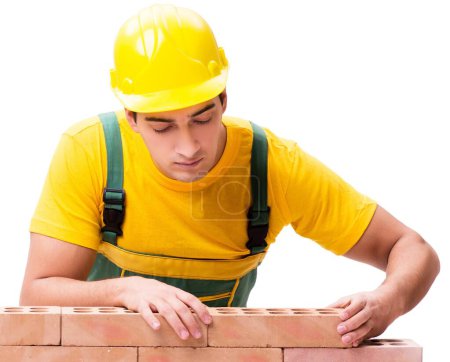 Foto de El trabajador de la construcción guapo edificio muro de ladrillo - Imagen libre de derechos
