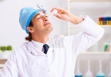 Photo for The young male doctor otolaryngologist working at the hospital - Royalty Free Image
