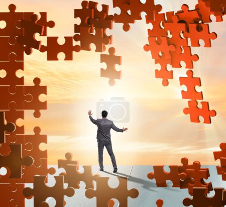 Photo for Businessman breaking wall of jigsaw puzzle - Royalty Free Image