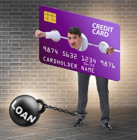 Photo for The businessman in credit card burden concept in pillory - Royalty Free Image