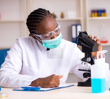 Photo for The young black chemist working in the lab - Royalty Free Image