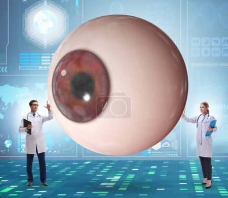 Téléchargez les photos : Le médecin examinant l'oeil géant dans le concept médical - en image libre de droit