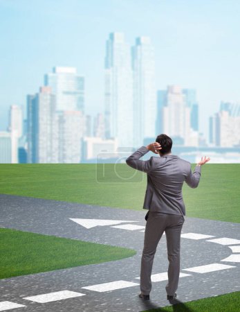 Photo for The young businessman at crossroads in uncertainty concept - Royalty Free Image