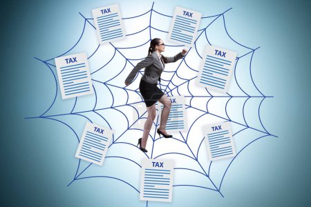 Photo for Businesswoman caught in web of taxes - Royalty Free Image