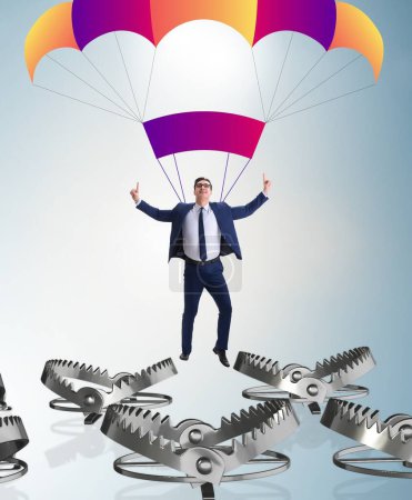 Téléchargez les photos : L'homme d'affaires tombe dans un piège en parachute - en image libre de droit