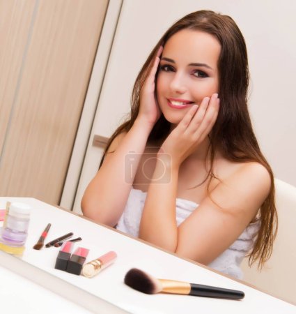 Photo for The woman doing make-up at home preparing for party - Royalty Free Image