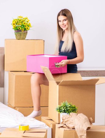 Photo for The young woman moving to new place - Royalty Free Image