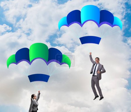 Photo for The business people falling down on parachutes - Royalty Free Image