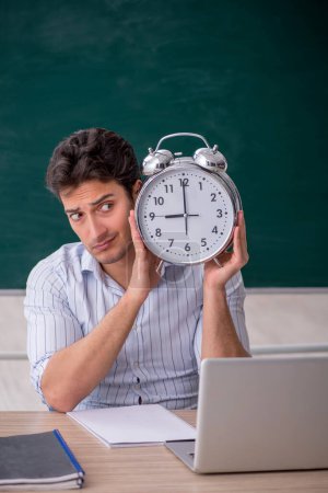 Photo for Young teacher in time management concept - Royalty Free Image