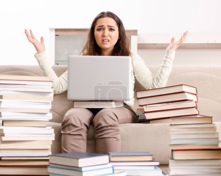 Photo for The young female student preparing for exams at home - Royalty Free Image