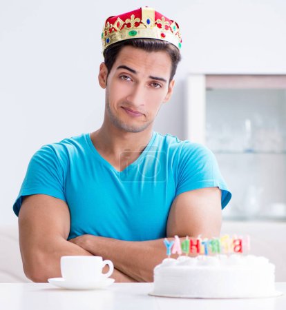 Photo for The young man celebrating birthday alone at home - Royalty Free Image