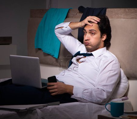Photo for The young employee working at home after night shift - Royalty Free Image