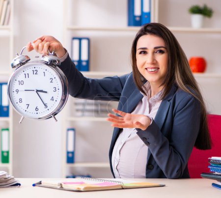 Photo for The young pregnant woman working in the office - Royalty Free Image