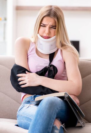 Photo for The injured woman student preparing to exams - Royalty Free Image