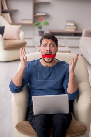 Photo for Mouth closed man working from home - Royalty Free Image