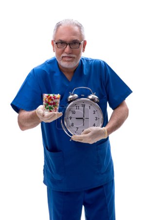 Photo for Old doctor in time management concept isolated on white - Royalty Free Image