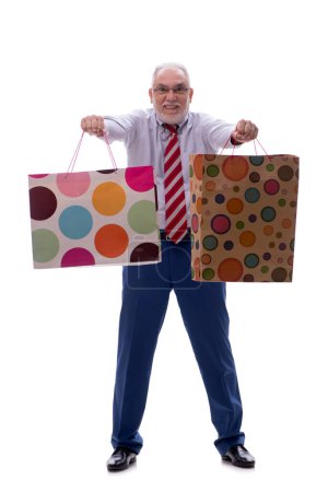 Photo for Old male boss holding bags isolated on white - Royalty Free Image
