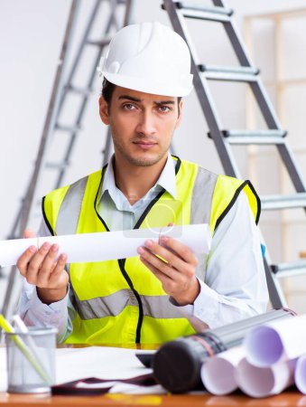 Photo for Young male architect working indoors on project - Royalty Free Image