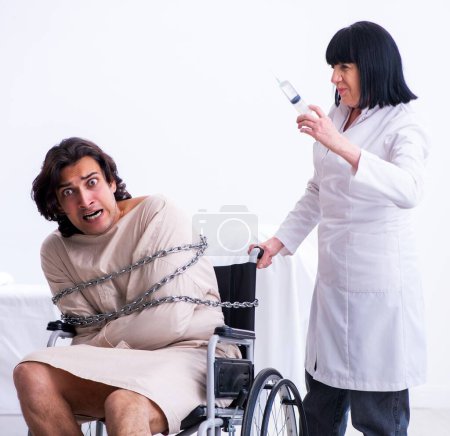 The old female psychiatrist visiting young male patient