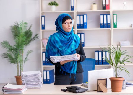 Photo for The female employee in hijab working in the office - Royalty Free Image