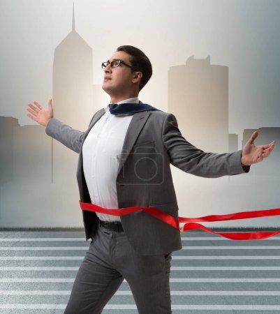 Photo for The businessman on the finishing line in competition concept - Royalty Free Image