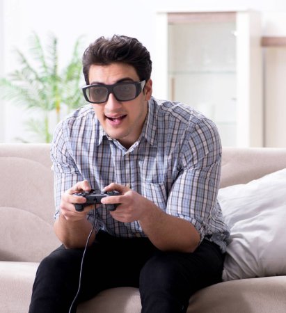 Téléchargez les photos : L'homme qui joue à des jeux 3D à la maison - en image libre de droit